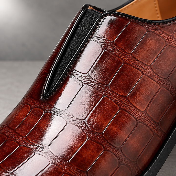 Macro — extreme close-up — Crocodile-embossed high-shine reddish-brown leather