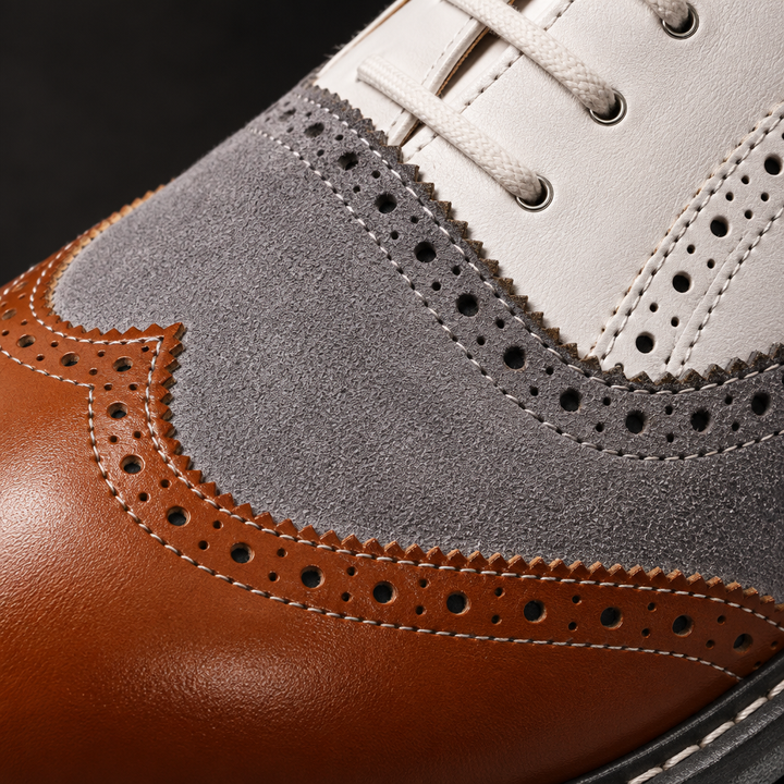 Macro — extreme close-up — Three-tone tan brown/grey suede/white colour blocking